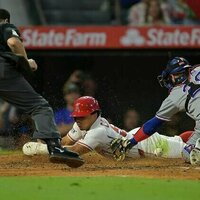 Angels bash three homers, end Rangers' winning streak