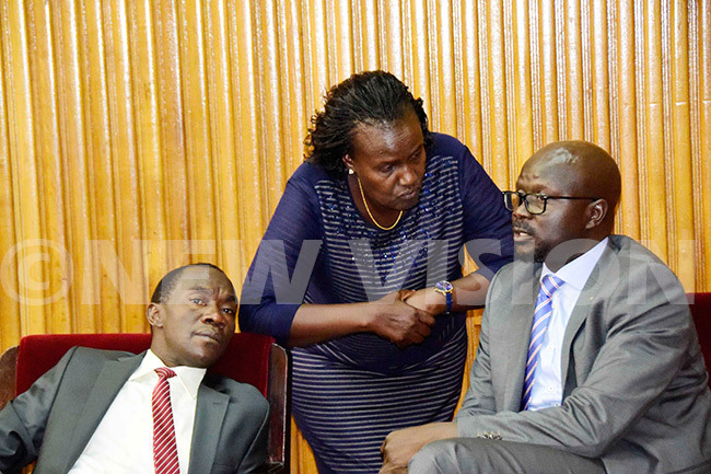  ast frica egislative ssembly ember of arliament ose kol centre consults eorge dongo right while aul usamali looks on during a meeting with ganda ational ureau of tandards and other government agencies at arliament in ampala on ebruary 07 2019 hoto by ennedy ryema