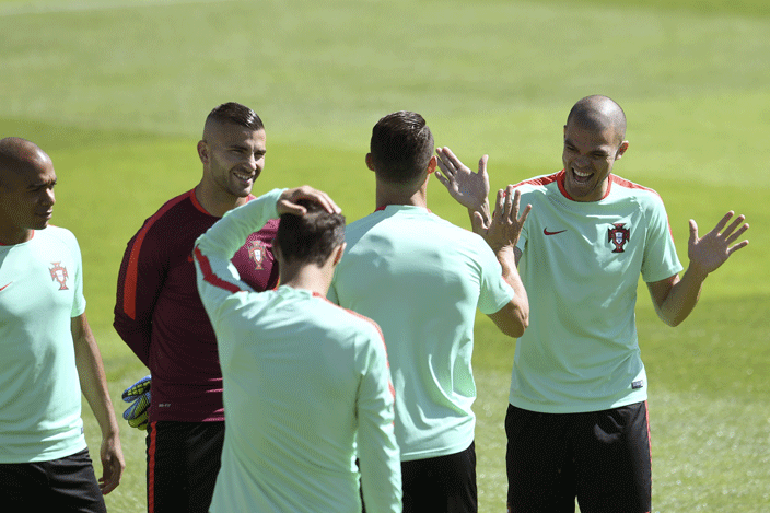  ortugals defender epe  jokes with teammates as he arrives for a training session at the ortugals base camp in arcoussis