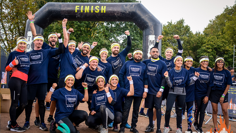 The GROHE UK team celebrating the completion of the Tough Mudder 2019 course