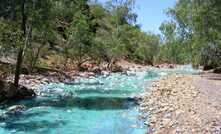 A creek near the Mount Oxide copper mine near Mount Isa has turned bright blue