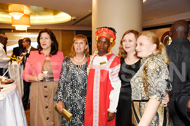 heraton staff member dressed in ussian traditional attire pose for a picture with the guests