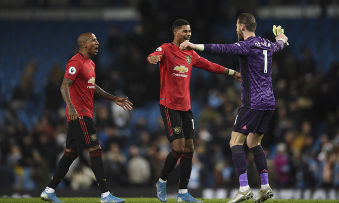 Football: United win feisty Manchester derby Football: United win feisty Manchester derby