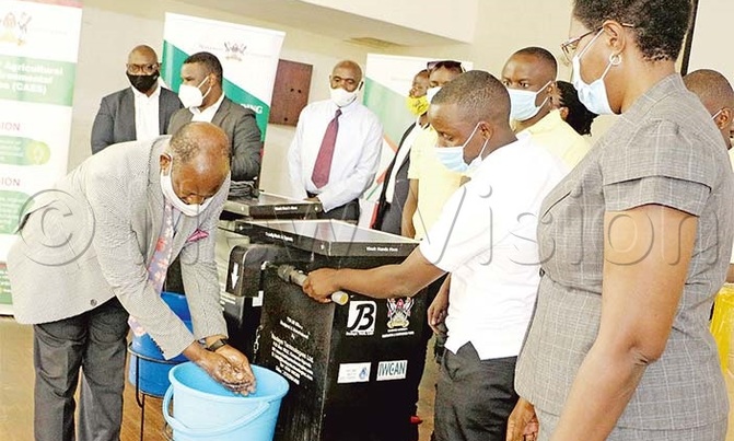 Makerere researchers invent touch-less hand washing machine Makerere researchers invent touch-less hand washing machine