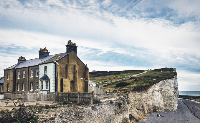 Uninhabited houses close to eroding coastline at Birling Gap in Sussex UK | Credit: iStock