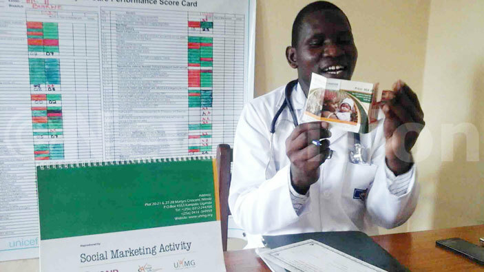  r amidu ugole the incharge of ugazi uslim health displaying a reproductive health voucher 