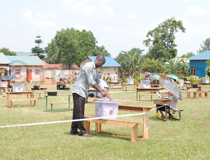   voter casting his ballot at icross ursery rimary chool olling tation in usega in ebruary  hoto by ary ansiime