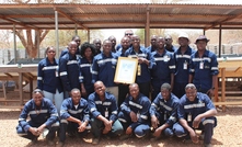 The team at Roxgold's Yaramoko mine in Burkina Faso with the Exploration certificate and trophy