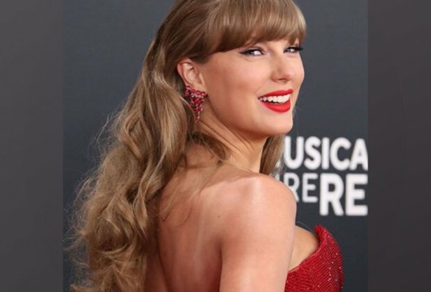 2025 Grammys Awards: Taylor Swift hits the red carpet in a red-hot look