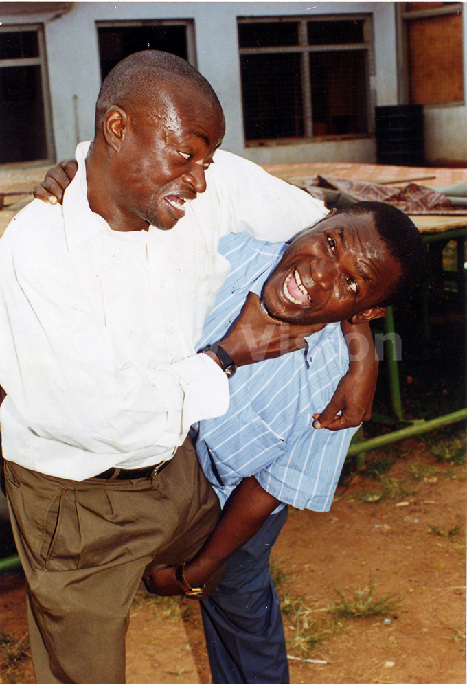 loysius atovu on left acting a scene in play entitled kagombe kenkomerero hoto by asudde lvis