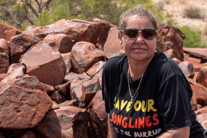 Raelene Cooper and hand petroglyph