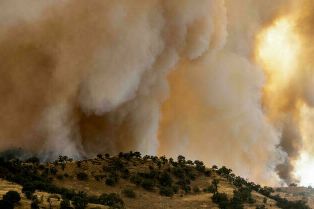 California wildfire explodes in size amid scorching heat, high winds