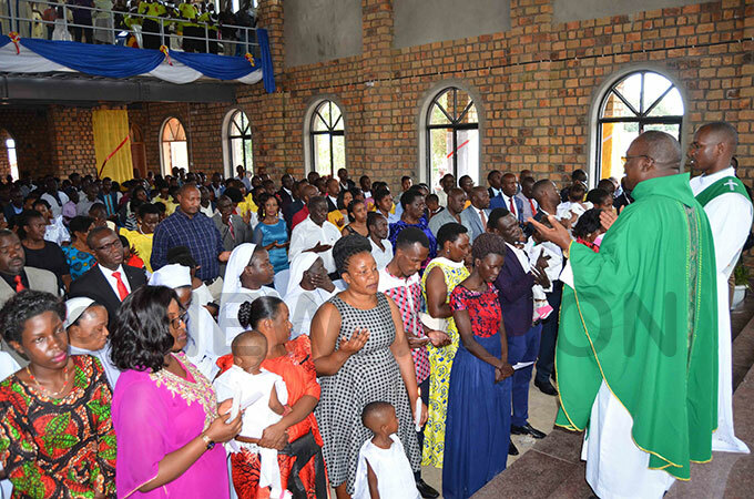  hristians attending mass inside the newly constructed church