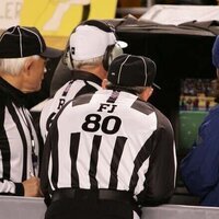 Replay officials throwing flags under consideration