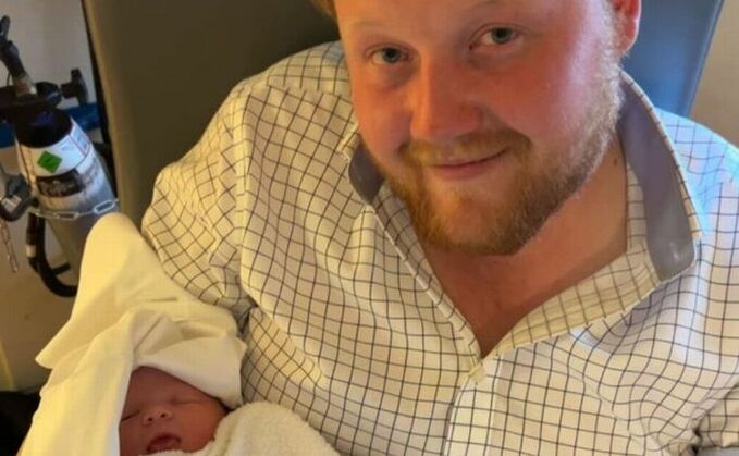 Kaleb Cooper with his newborn daughter Willa Grace Cooper