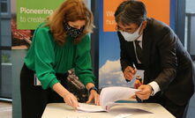  Rio Tinto Australia chief executive Kellie Parker and Sumitomo Australia Director of Mineral Resources & Energy Kenji Suzuki sign a letter of intent in Brisbane