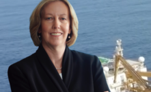 Woodside CEO Meg O’Neill pictured in front. Behind, a drillship supporting Senegal’s historic Sangomar oil project, the nation’s first offshore development to reach production.