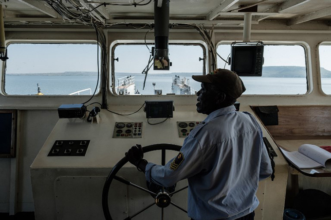 he captain steers the ferry boat sailing from uanda tieno  hoto 