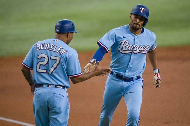Rangers bash six home runs, fend off Mariners