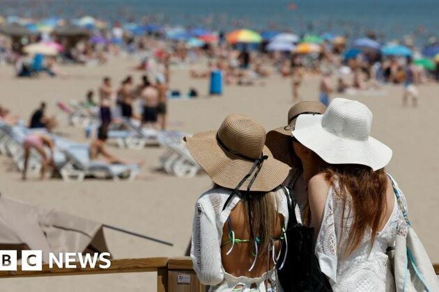 UK weather- Temperatures surpass 33C as storm warning kicks in