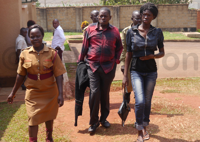 ugoya awazi being led to the court room hoto by ichael deng