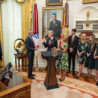 Donald Trump's session with reporters cut short after young girl faints in Oval Office