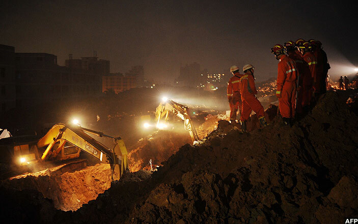 escuers look for survivors after the landslide that hit an industrial park in henzhen