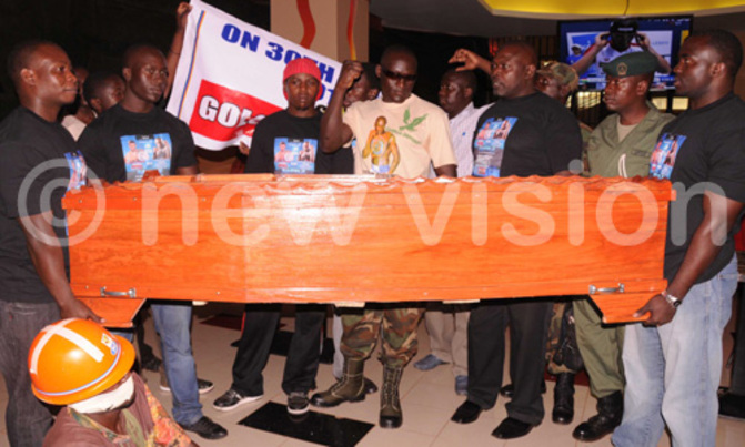 Tugume buys coffin for Golola Tugume buys coffin for Golola