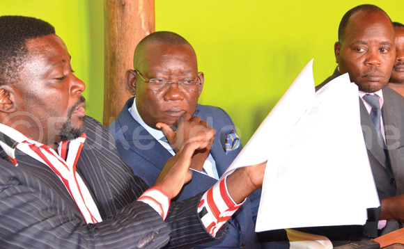 Omubaka Kato Lubwama (wakati) nga yeetegereza ebiwandiiko ebyamuweereddwa e Makerere ku yunivasite gye buvuddeko Omubaka Kato Lubwama (wakati) nga yeetegereza ebiwandiiko ebyamuweereddwa e Makerere ku yunivasite gye buvuddeko