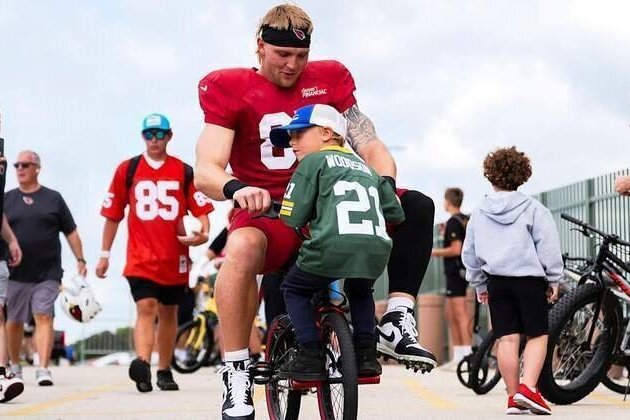 Cardinals Pedal To Practice During Memorable Green Bay Tradition