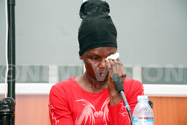  ertrude akimbugwe a witness in a land grabbing matter shades tears before the ommission of nquiry into land matters chaired by ustice atherine amugemereire at the rchives entre in andegeya ampala he pinned a real estate dealer for having forged her signature and documents to defraud land totaling to over 220 acres at uwagga village in usukuma ub ounty akiso district ebruary 07 2019 hoto by ddie sejjoba