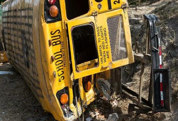 Bus with high school band tumbles down ravine, killing two