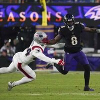 Ravens QB Lamar Jackson (back) departs against Patriots