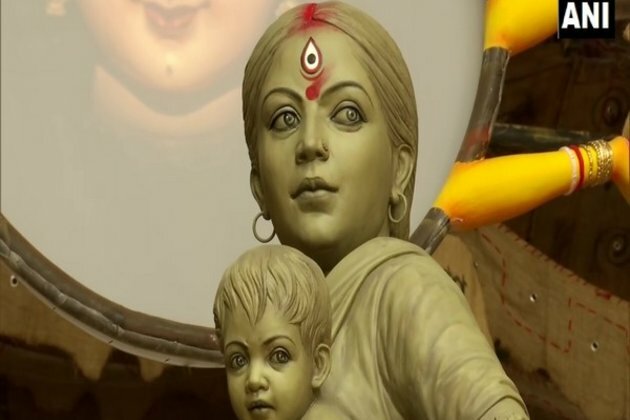 Walking back miles from big city -- Durga finally home with children