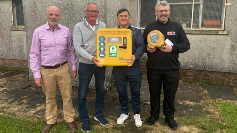 PDM donates defibrillator to local football team