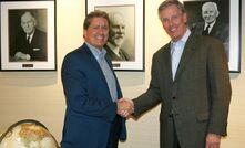 Bob Gomes, president and CEO of Stantec with Alan Krause, chairman and CEO of MWH Global