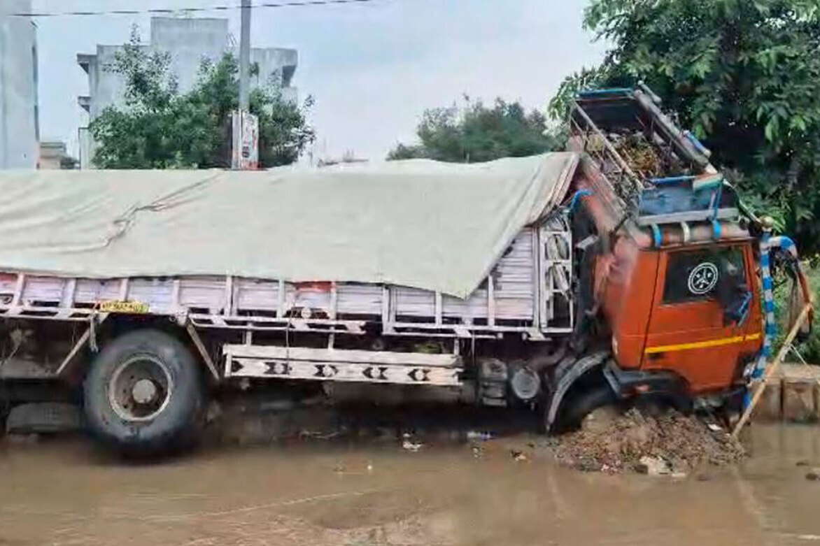 Haryana: Cement-laden truck sinks into road in Gurugram Sector 9 amid heavy rain, waterlogging