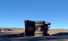 The operator lost control of the fully-laden truck on a recently watered road. 