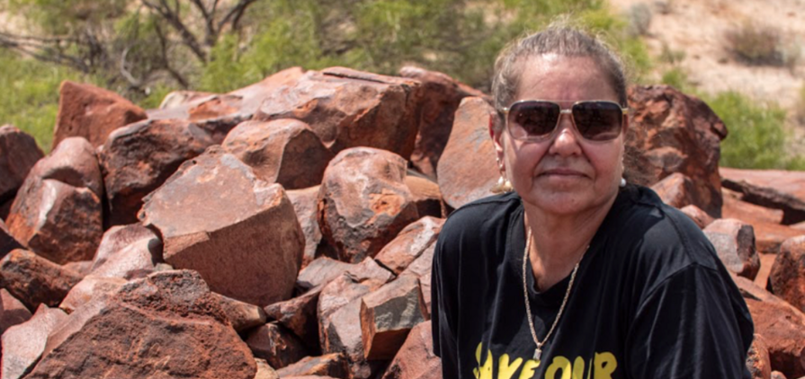 Raelene Cooper and hand petroglyph