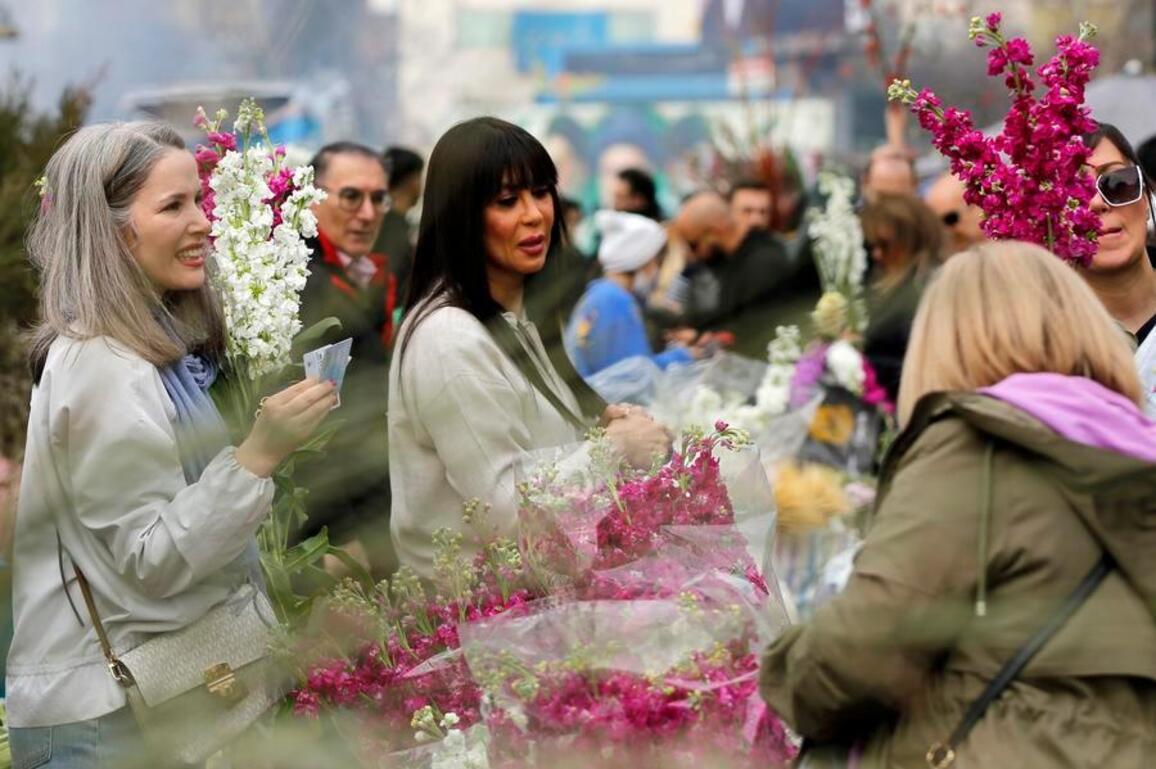 Mideast in Pictures: Iranians buy flowers for Nowruz celebrations amid airstrikes