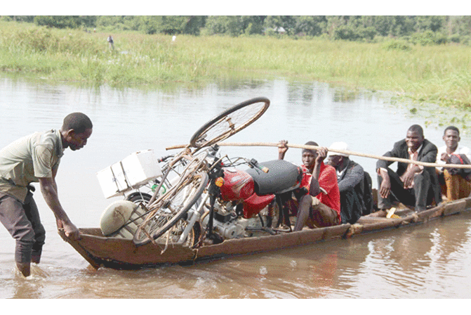 In pictures: Floods close roads in northern Uganda In pictures: Floods close roads in northern Uganda