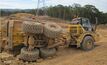 The articulated dump truck after tipping on its side.