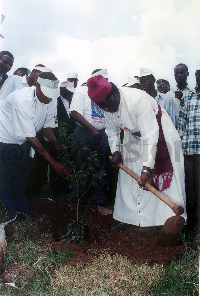ormer hurch of ganda rchishop palanyi koyoyo c plants a tree to mark the   campaign in memory of the late hilly utaaya at the entenary ark on ovember 7 2011