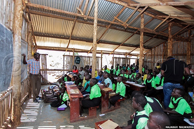   teacher teaching pupils of orld iew rimary chool and  at alabek refugee settlement alabek gili ub ounty amwo district orthern ganda hoto by ajarah alwadda