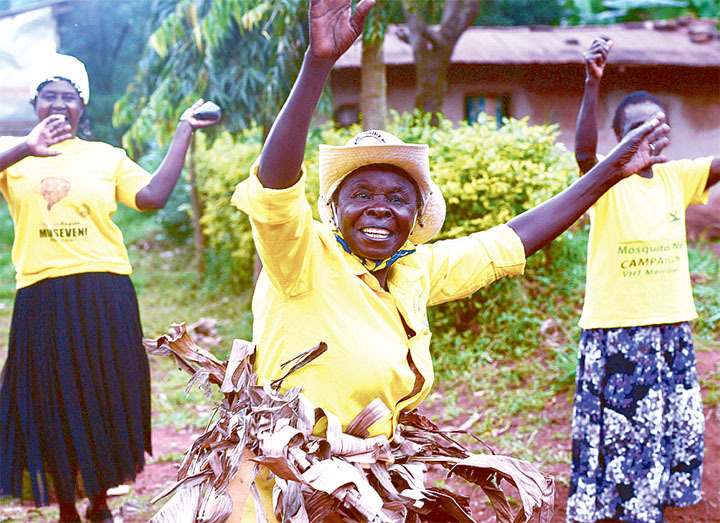 Women cheering for Museveni