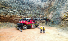  High reach drill in Paris pit installing ground support for the new portal to be established