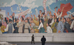  People standing in front of a North Korean propaganda poster in Pyongyang Credit: Stephen Anthony Rohan 