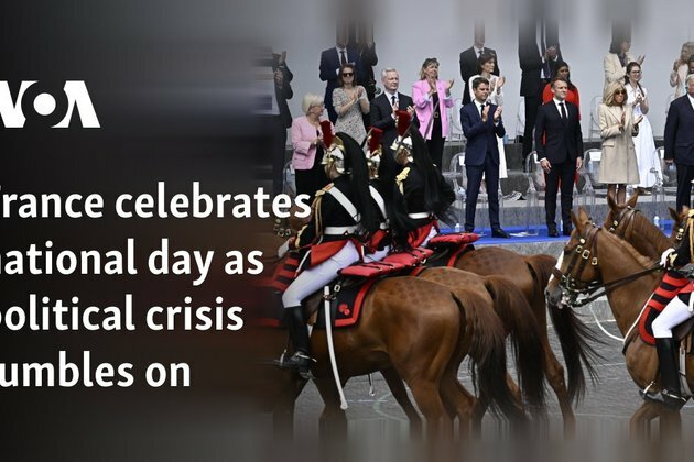 France celebrates national day as political crisis rumbles on
