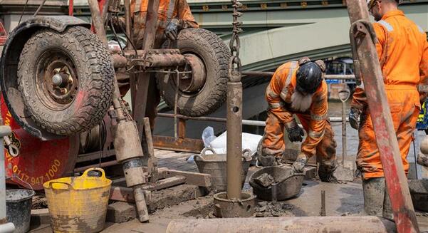 Engineers from Structural Soils conducted overwater drilling beside the Palace of Westminster using a jack-up barge on the River Thames