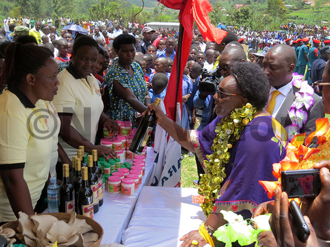  arooro admires locally made wine during celebrations hoto by ob amanya